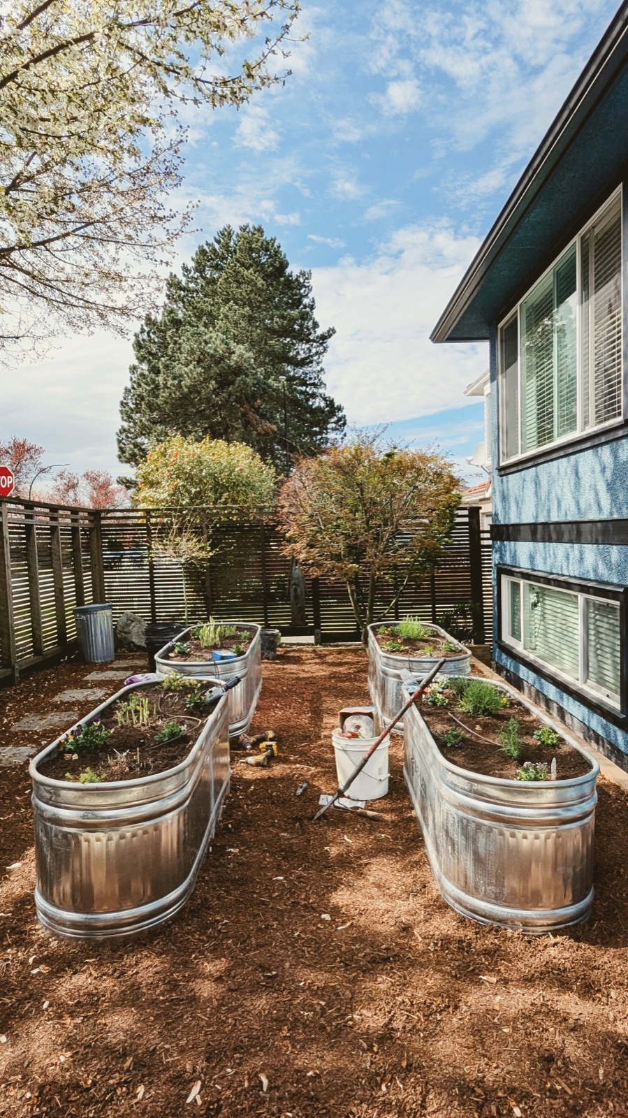 Galvanized raised bed installation in a back yard